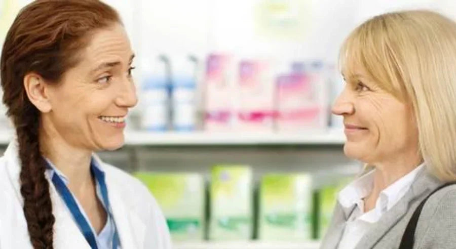 two women smiling at each other